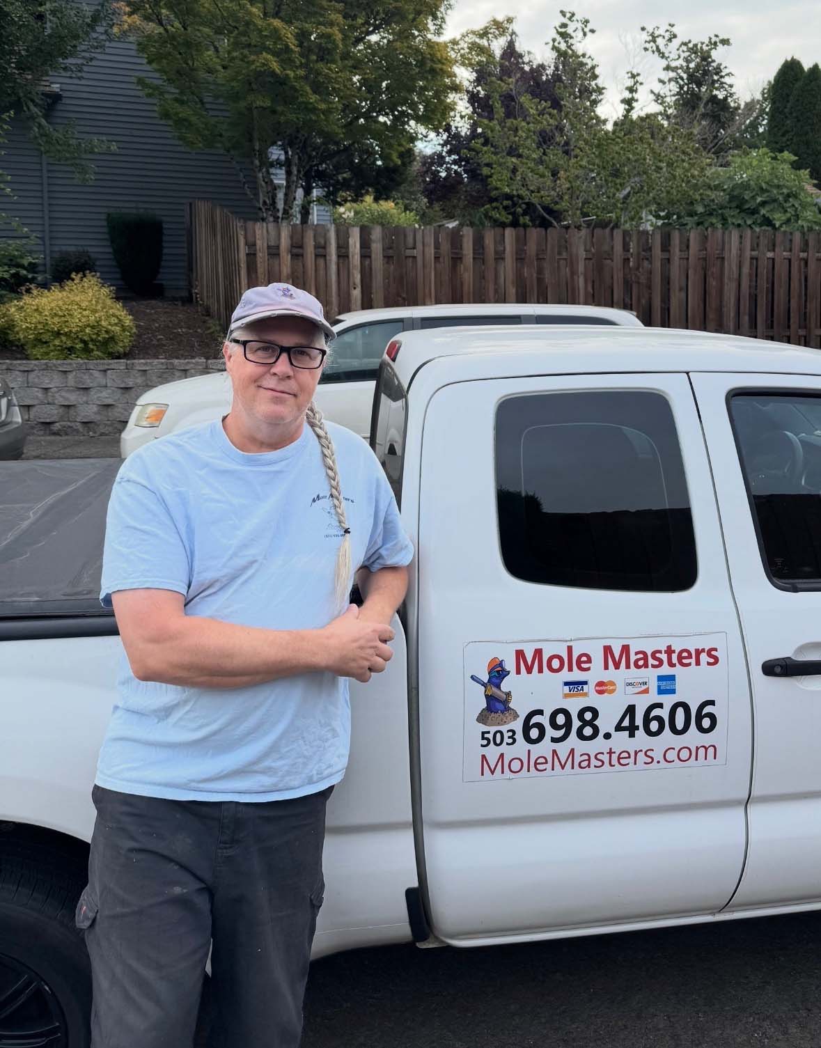 Roger with Mole Masters specializing in difficult mole trapping near walkways and rock walls